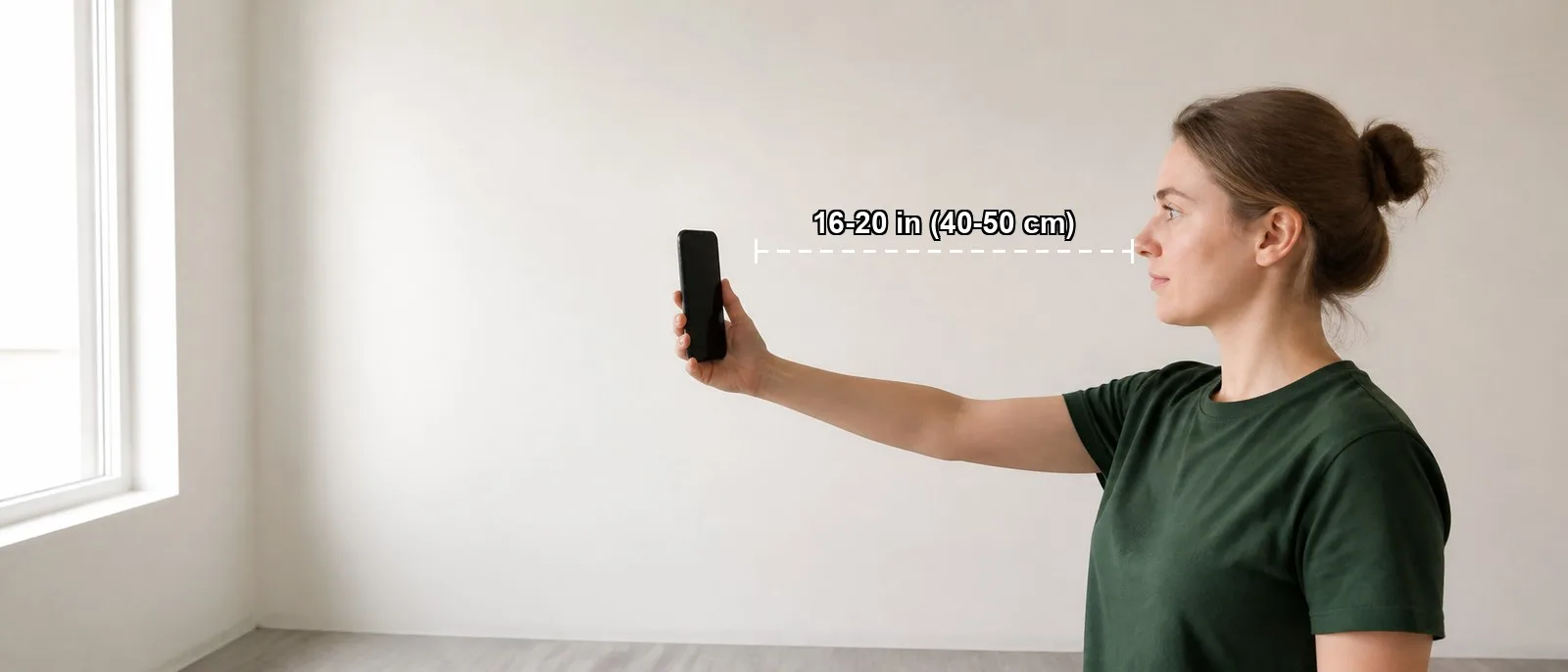Stand facing a window, with a plain wall behind you